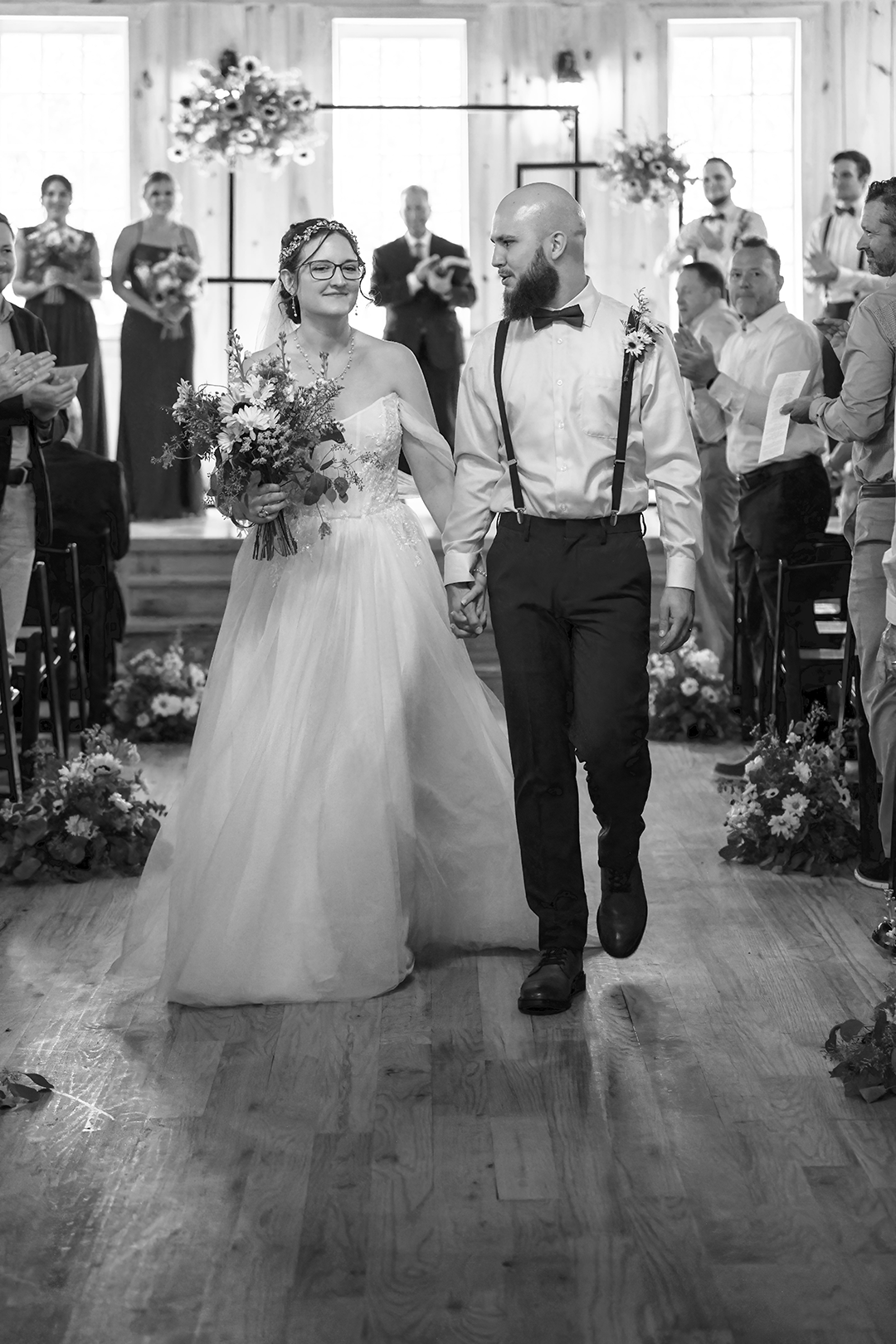 Bride walking around a pond on her way to the ceremony area. 