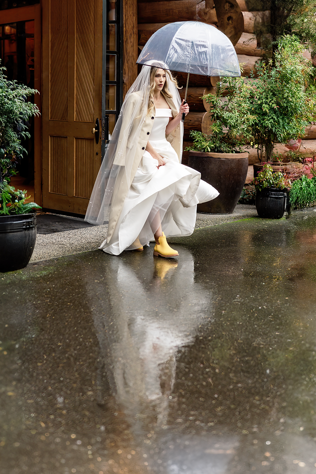 Rainy first look with clear umbrella and yellow rain boots