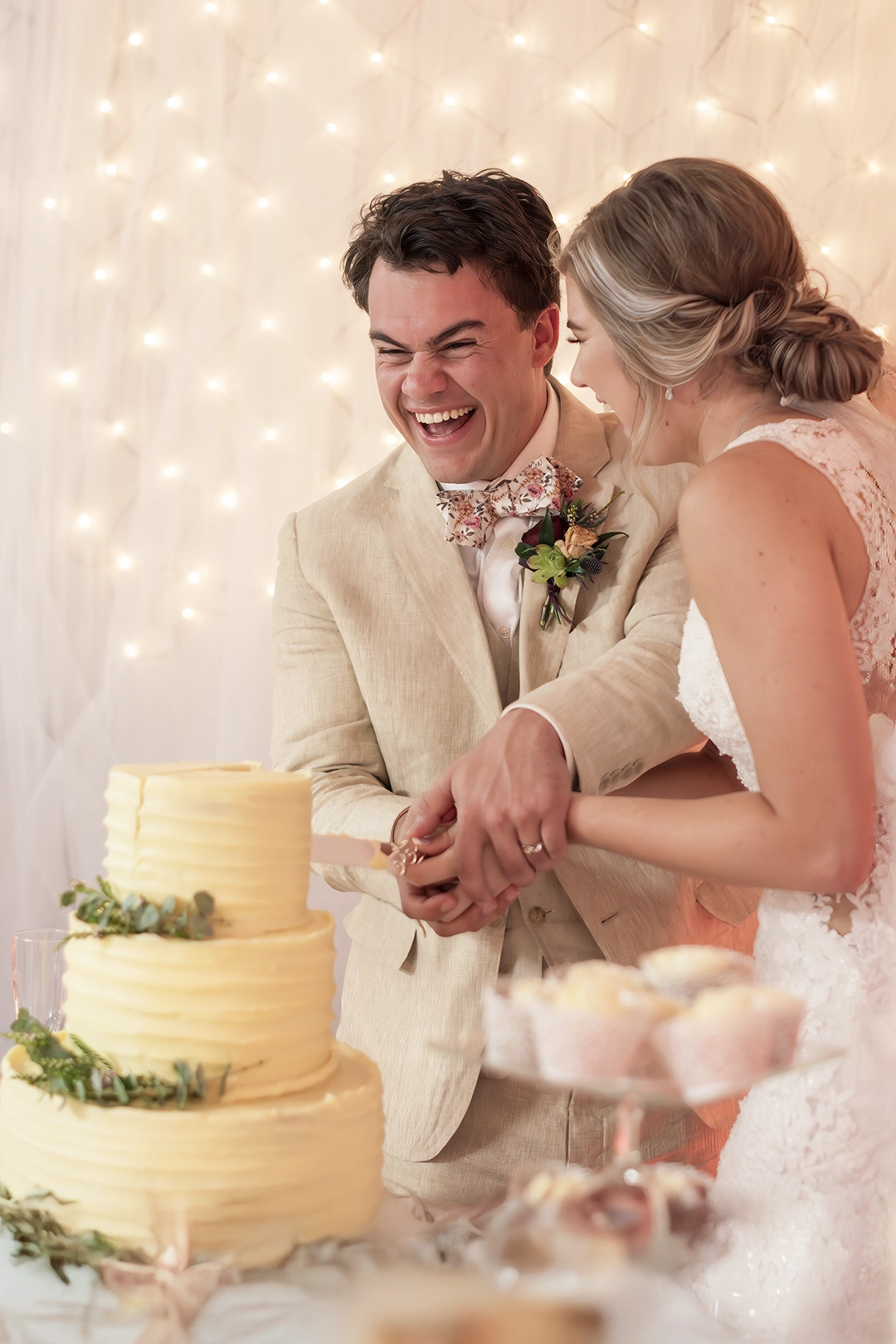 Couple cuts their wedding cake during their reception