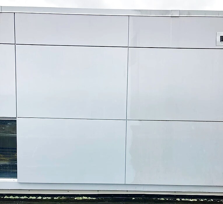 Alucobond ACM panels brushed clean showing bright shine versus dirty haze