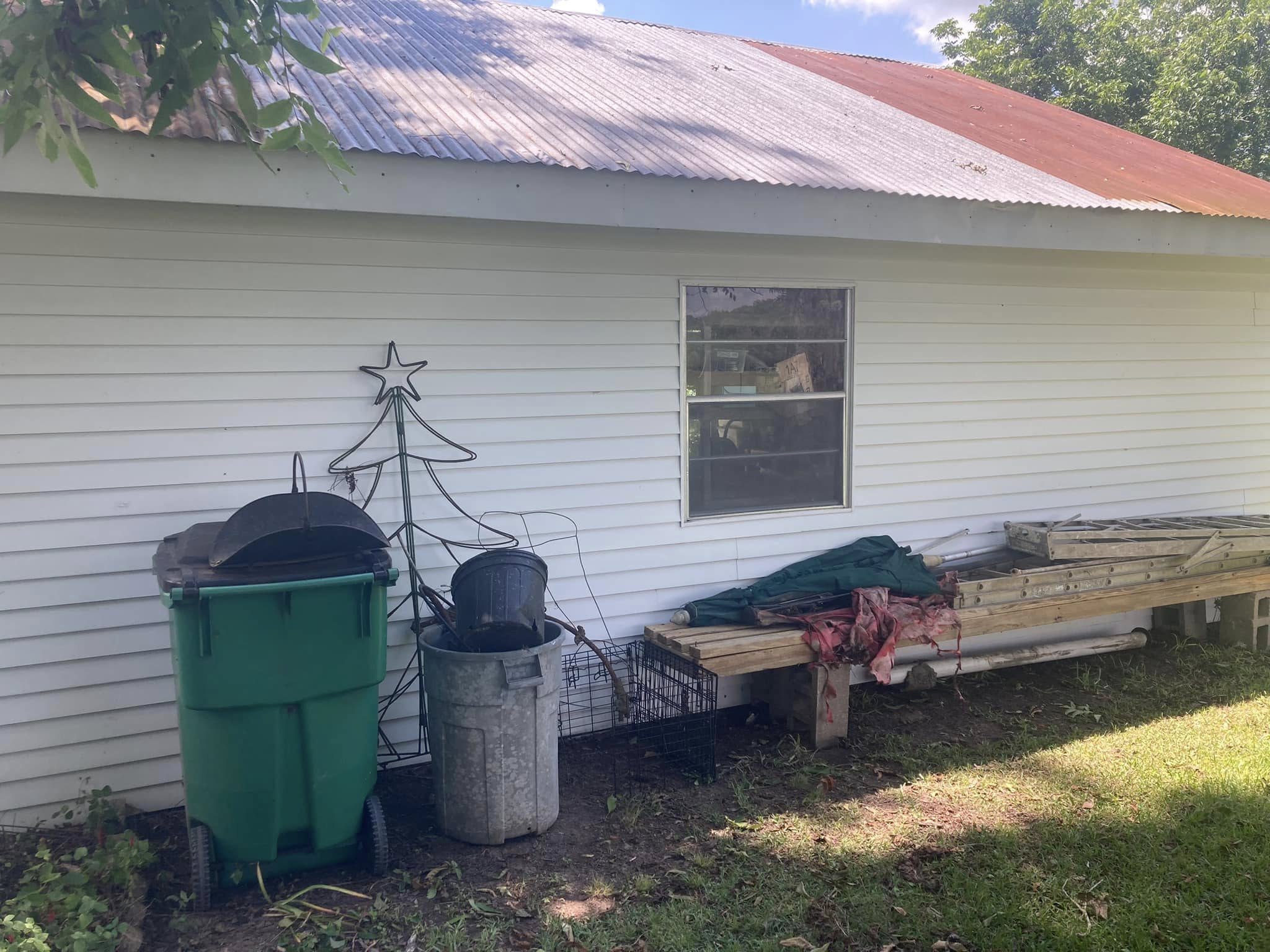 Clean house siding after professional pressure washing