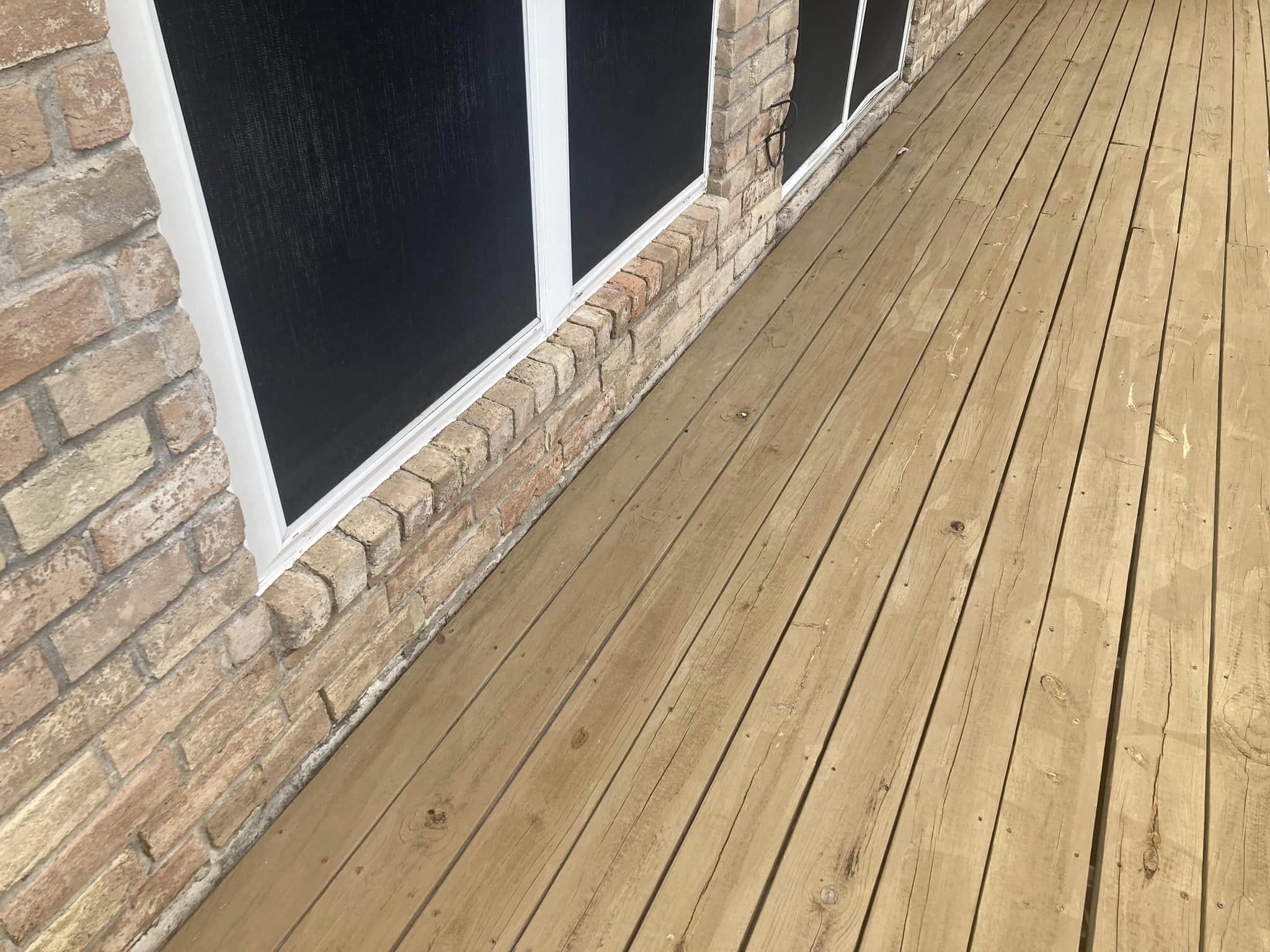 Newly stained wood fence with rich, protective finish