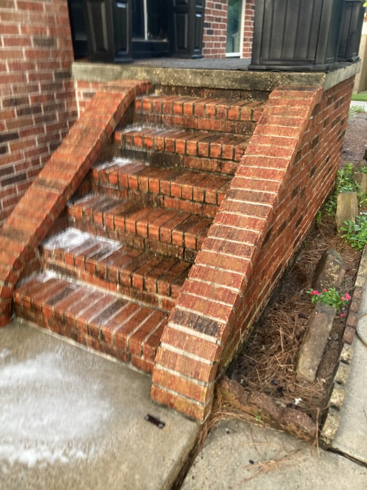 Cleaned brick surface after low-pressure pressure washing