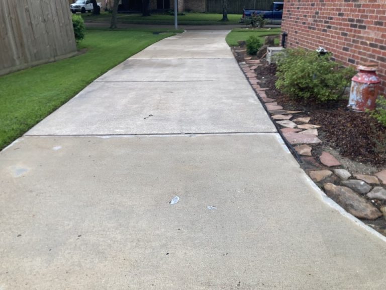 Driveway with oil stains and tire marks removed