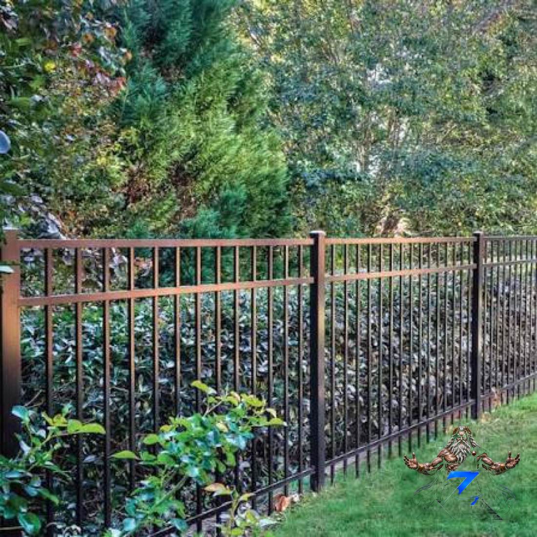 Black ornamental iron fence installed along a landscaped yard