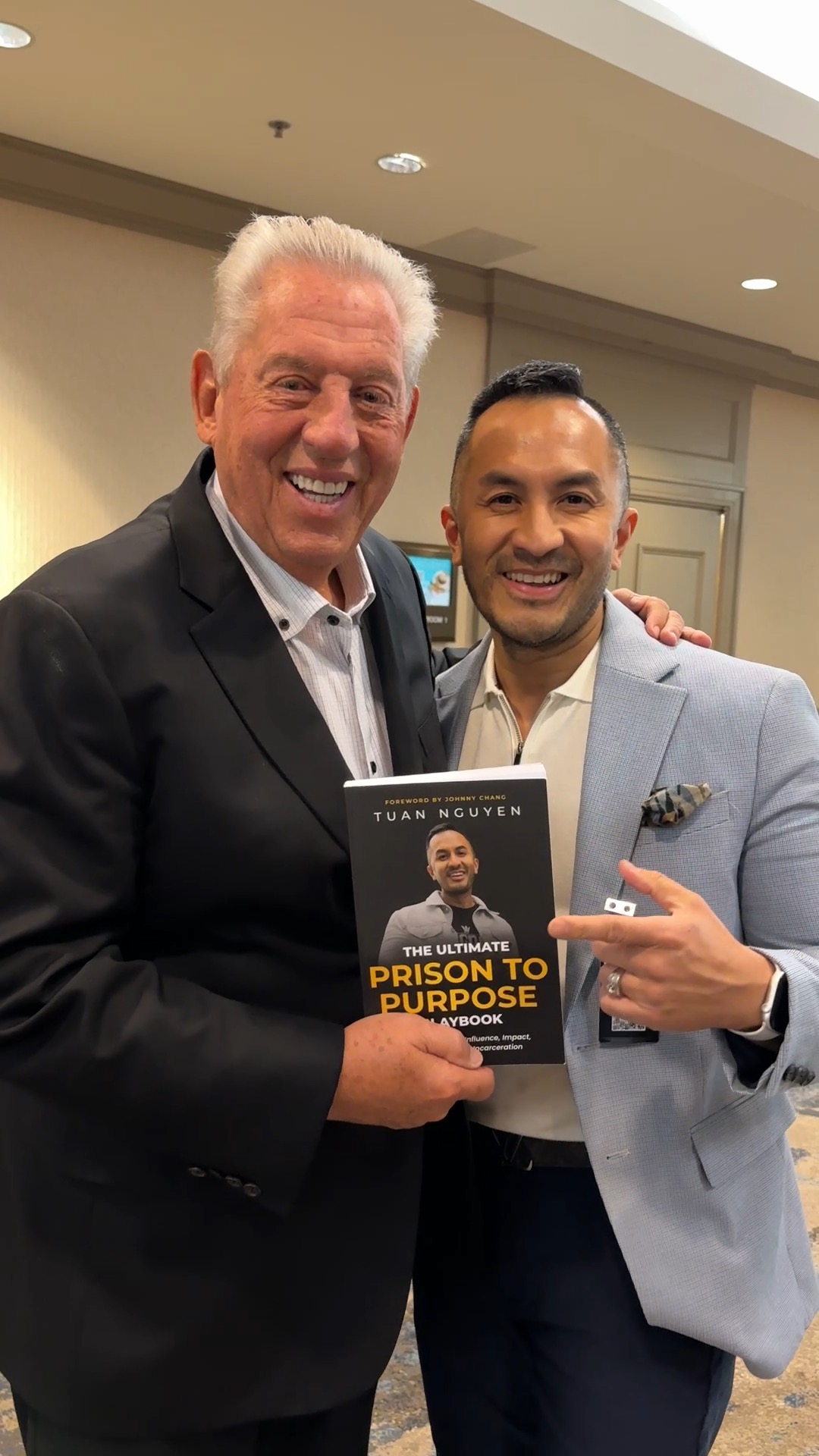 John Maxwell holding Tuan's book