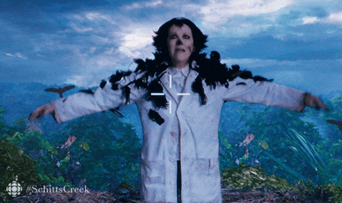 Moira Rose covered in crows in The Crowening