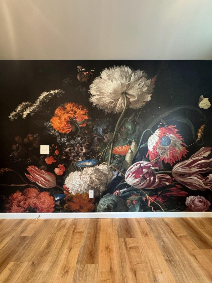 Decorative floral feature wall with dark botanical mural