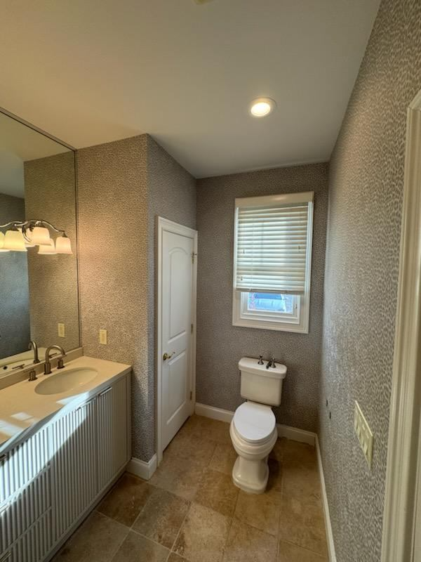Finished bathroom with textured patterned wall treatment