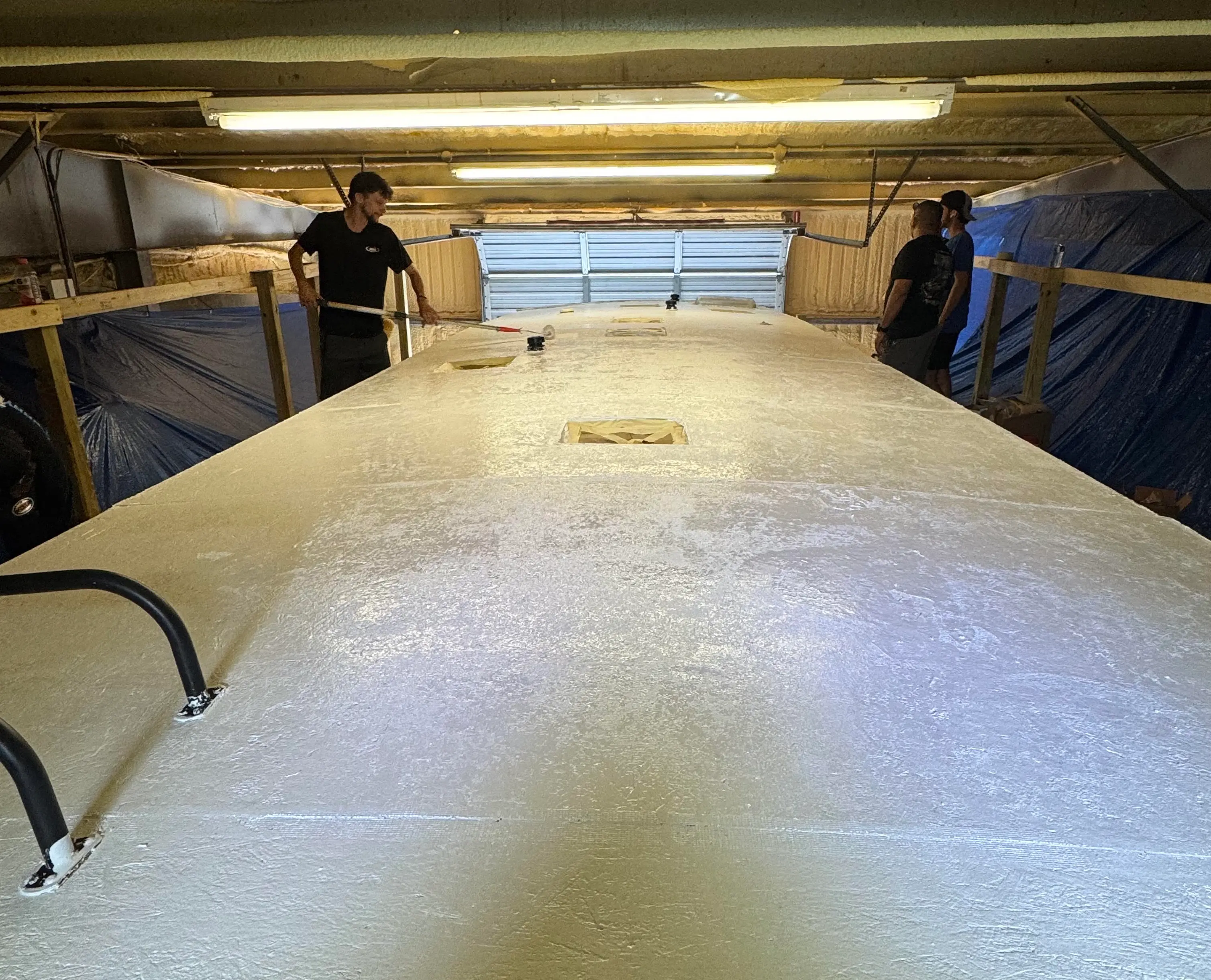 Cleaning the top of an RV in preparation for coating