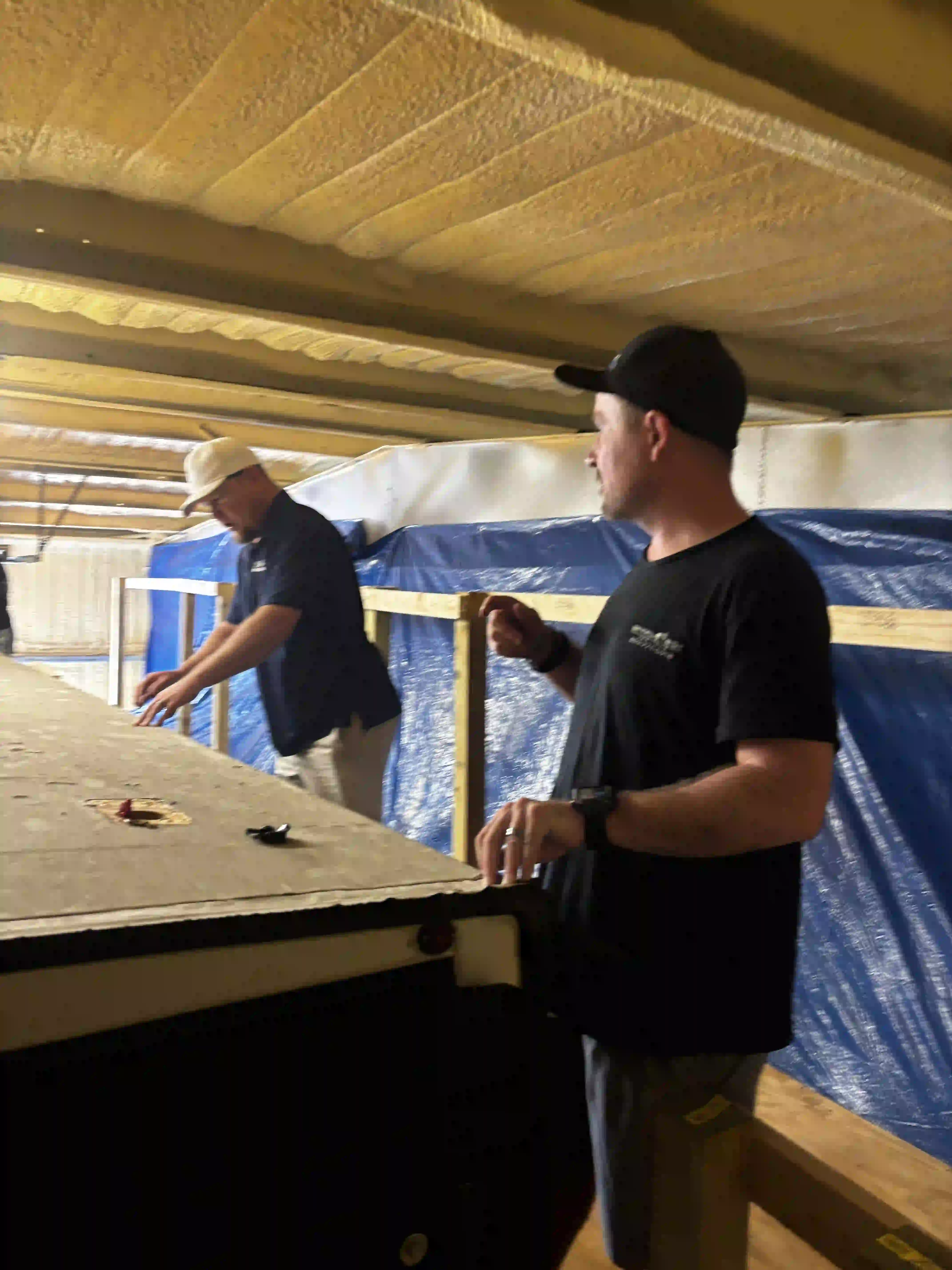 Technicians preparing RV roof in Panama City FL for seamless weather-resistant coating application