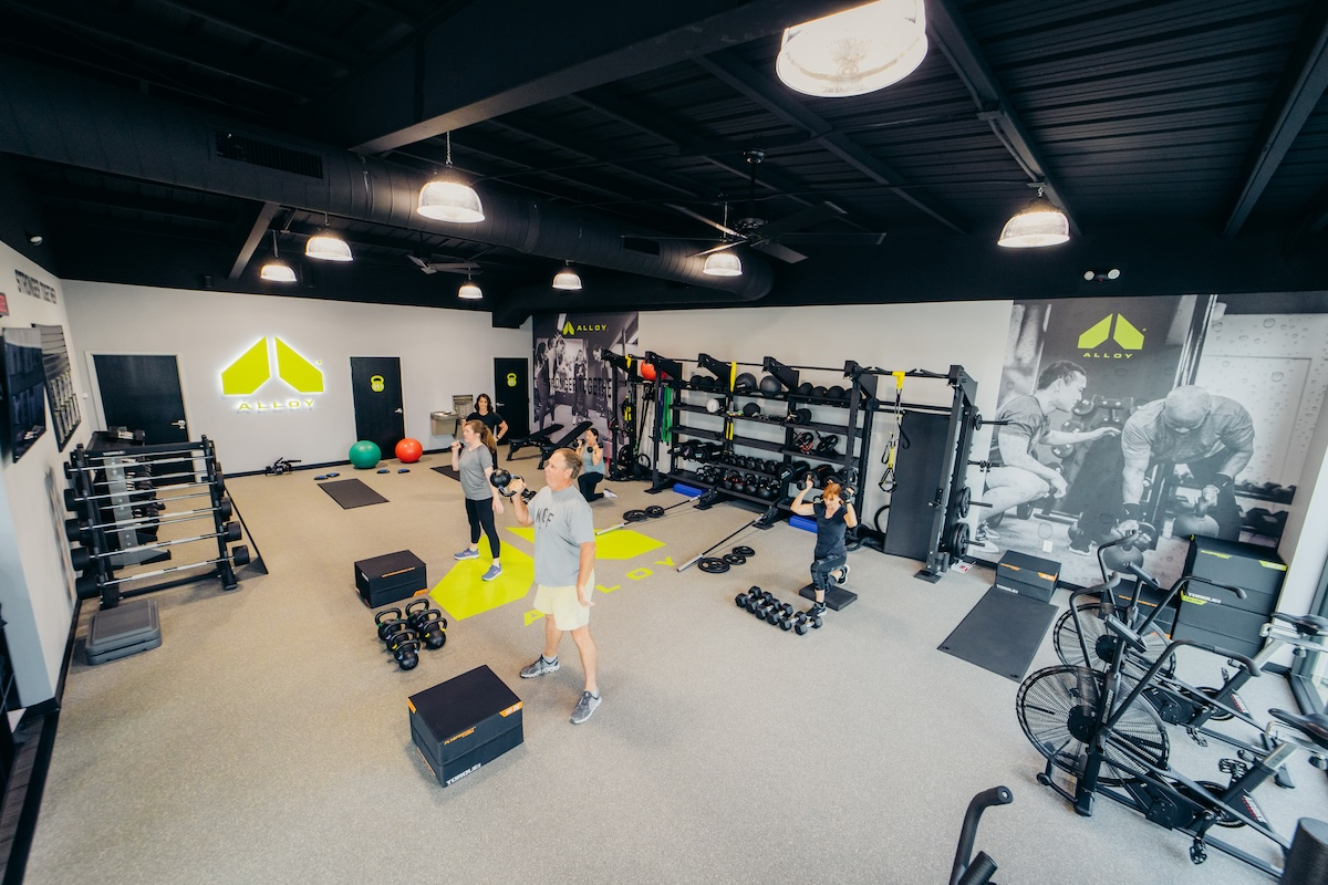 Small group fitness class for adults over 40, showcasing community and motivation