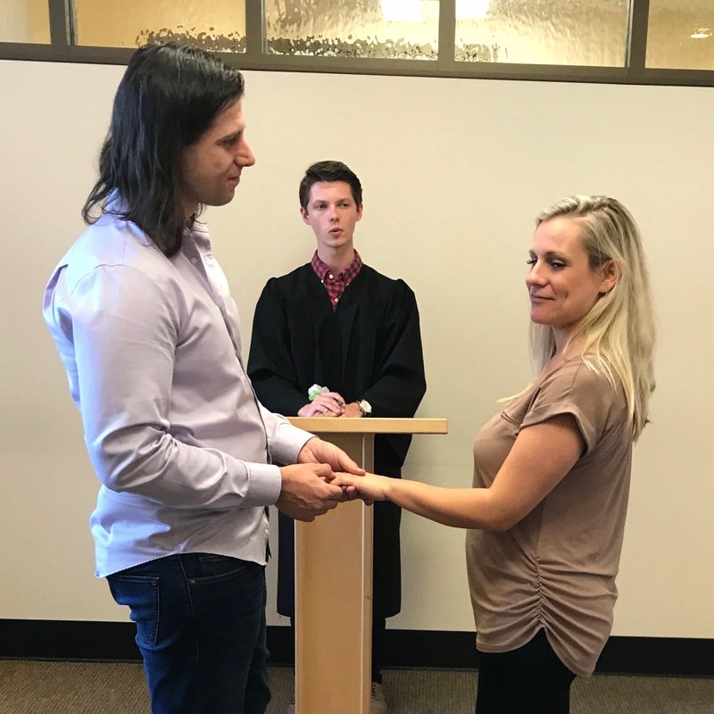 Holding hands at our courthouse wedding