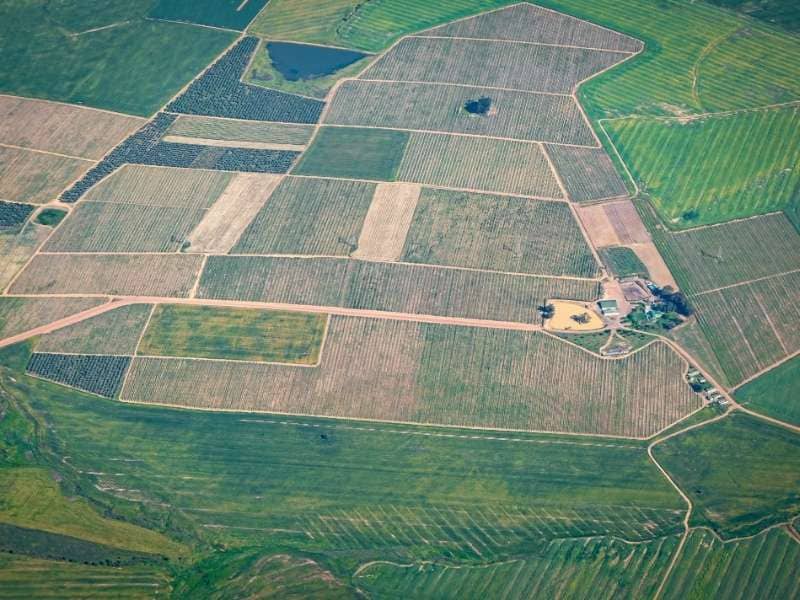 Aerial view of agricultural fields, access roads, and terrain features relevant to LiDAR mapping.
