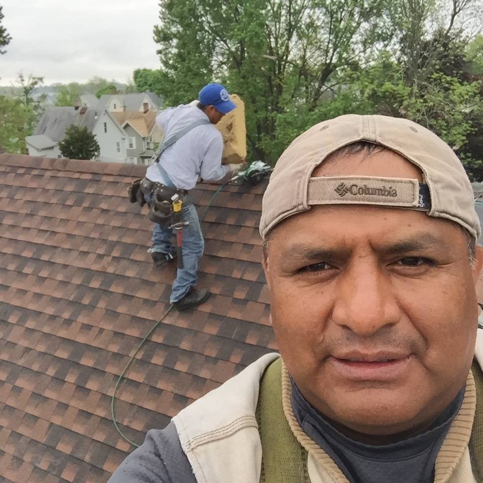 Franklin Bravo's uncle working on a roof