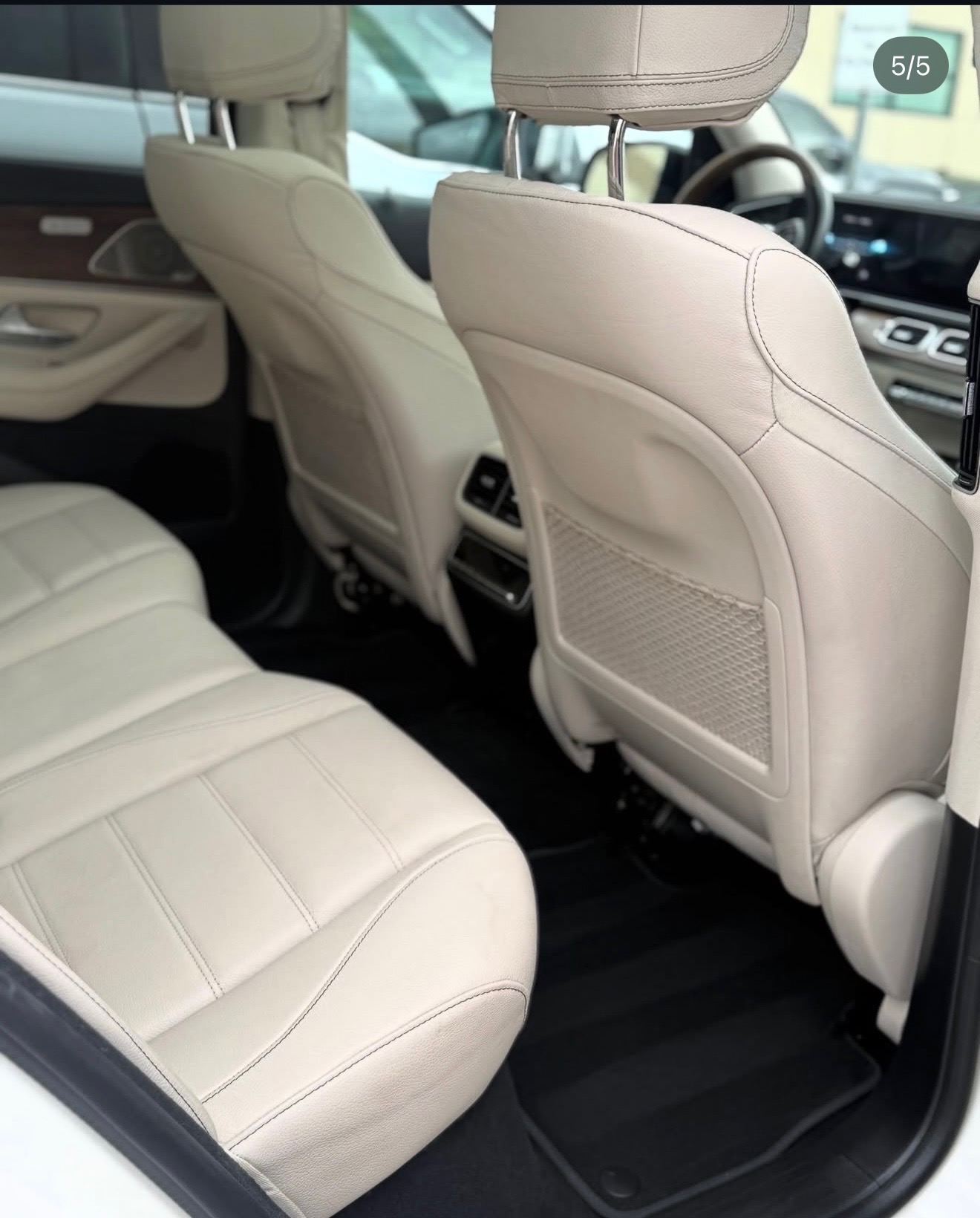 Pristine cream leather interior of a detailed Mercedes SUV