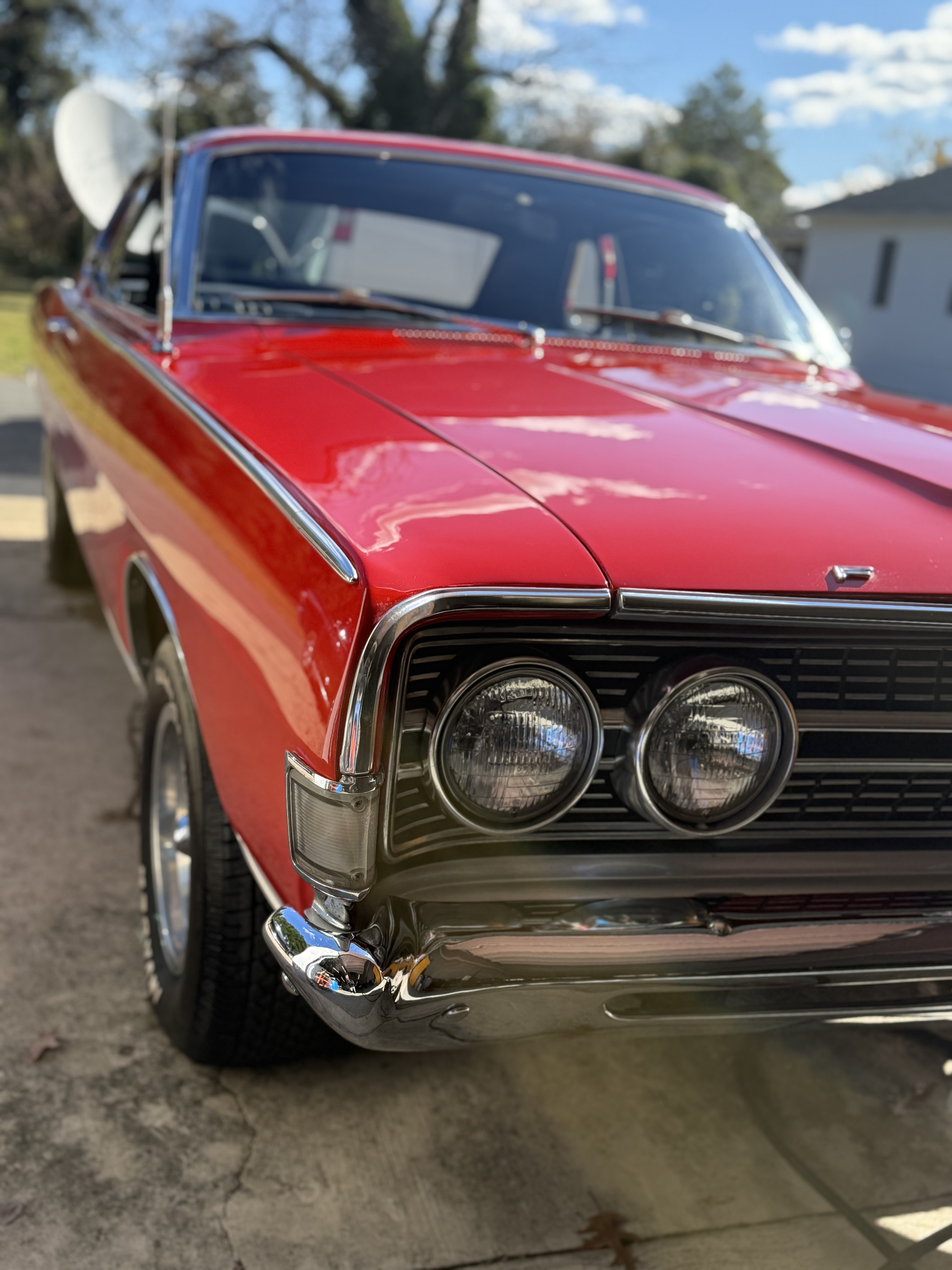 Classic red sports car with a flawlessly polished finish