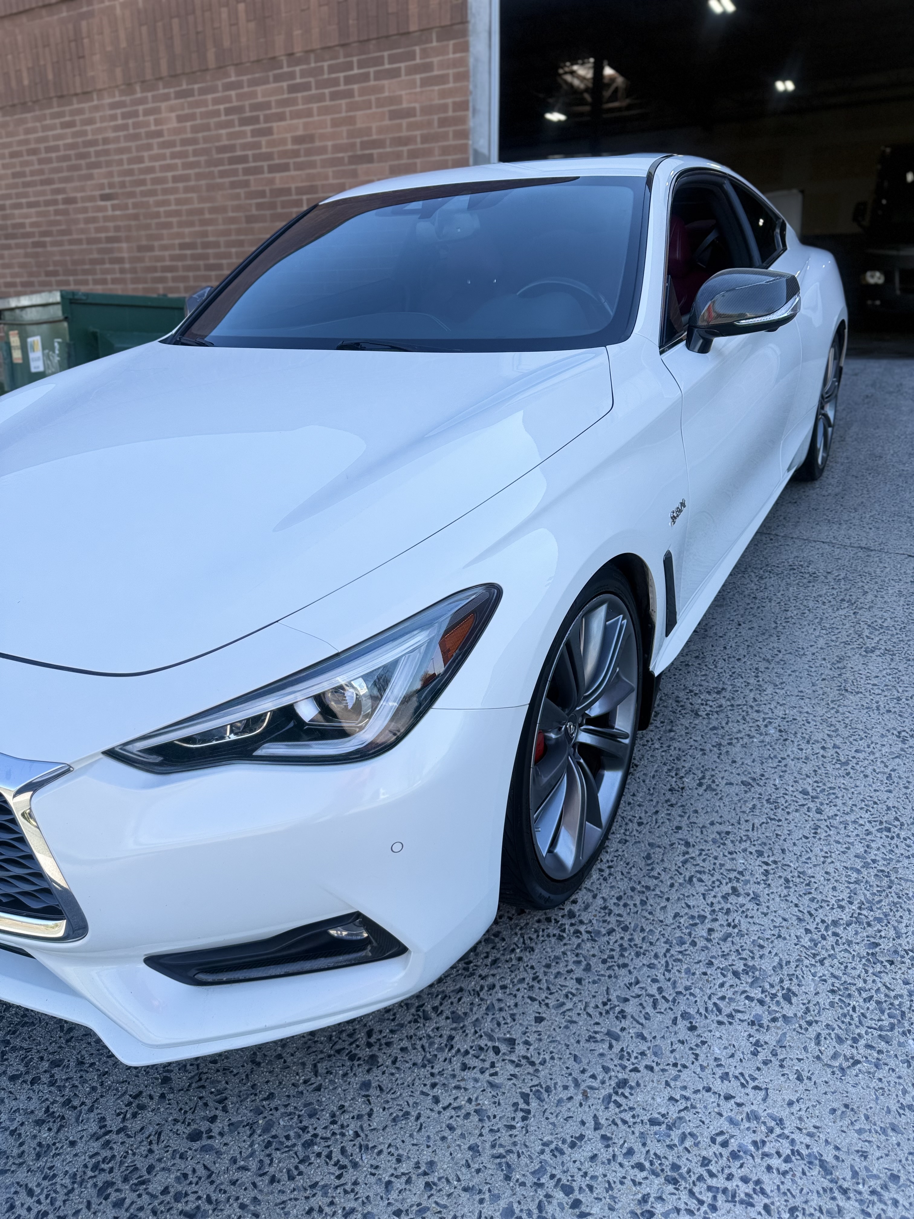 Freshly detailed white Infiniti Q60 exterior