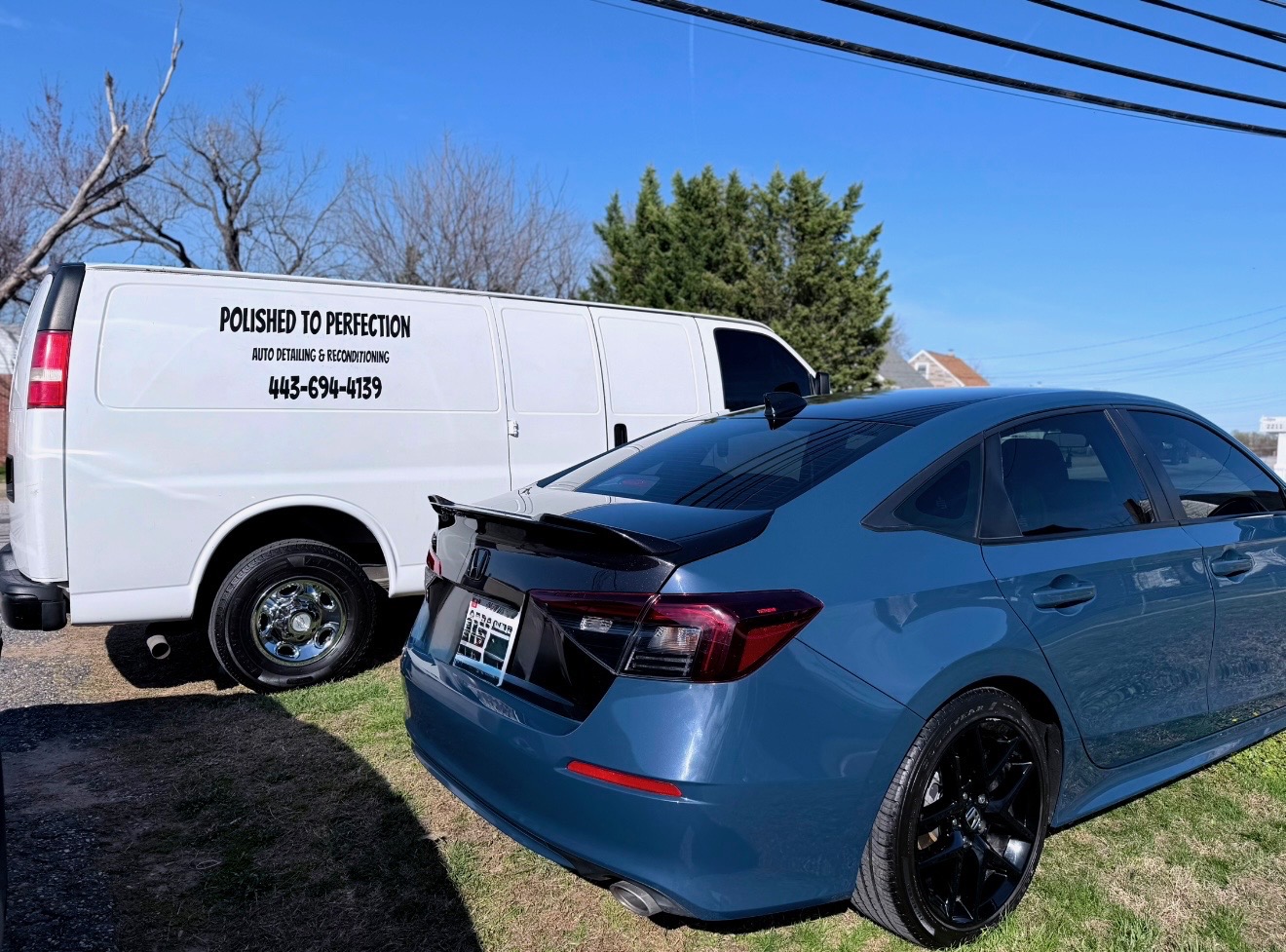 Charlie with the Polished To Perfection service van alongside a freshly detailed Honda Civic