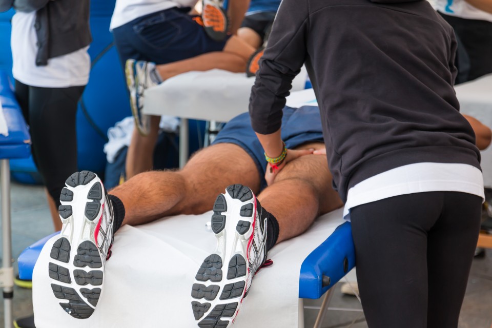 Athleticare athletic trainer caring for a high school athlete