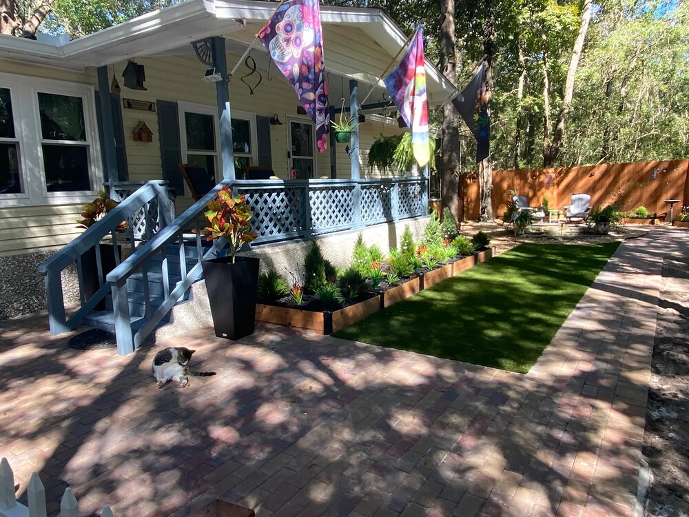 Paver patio and landscaping transformation by Rock Solid Structures