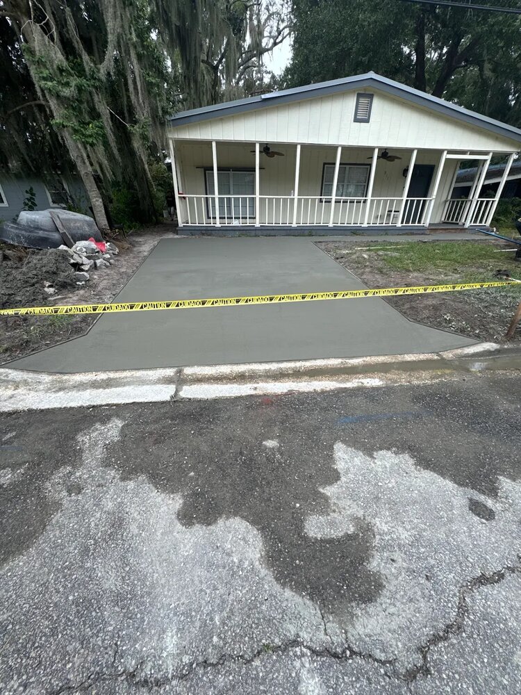 New concrete driveway poured by Rock Solid Structures
