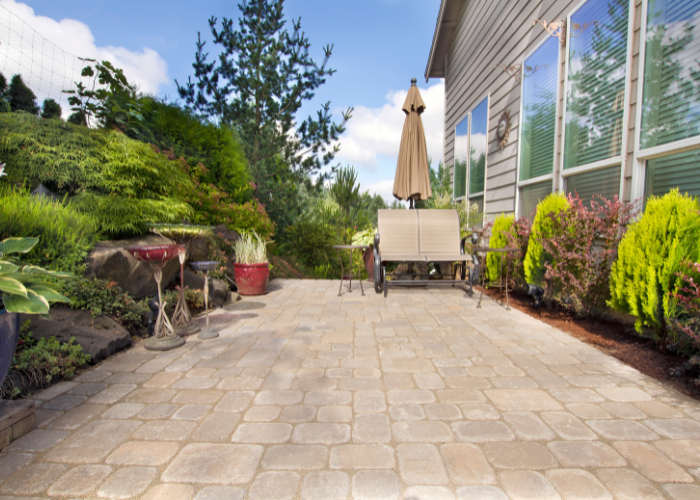 backyard paver patio with garden accessories