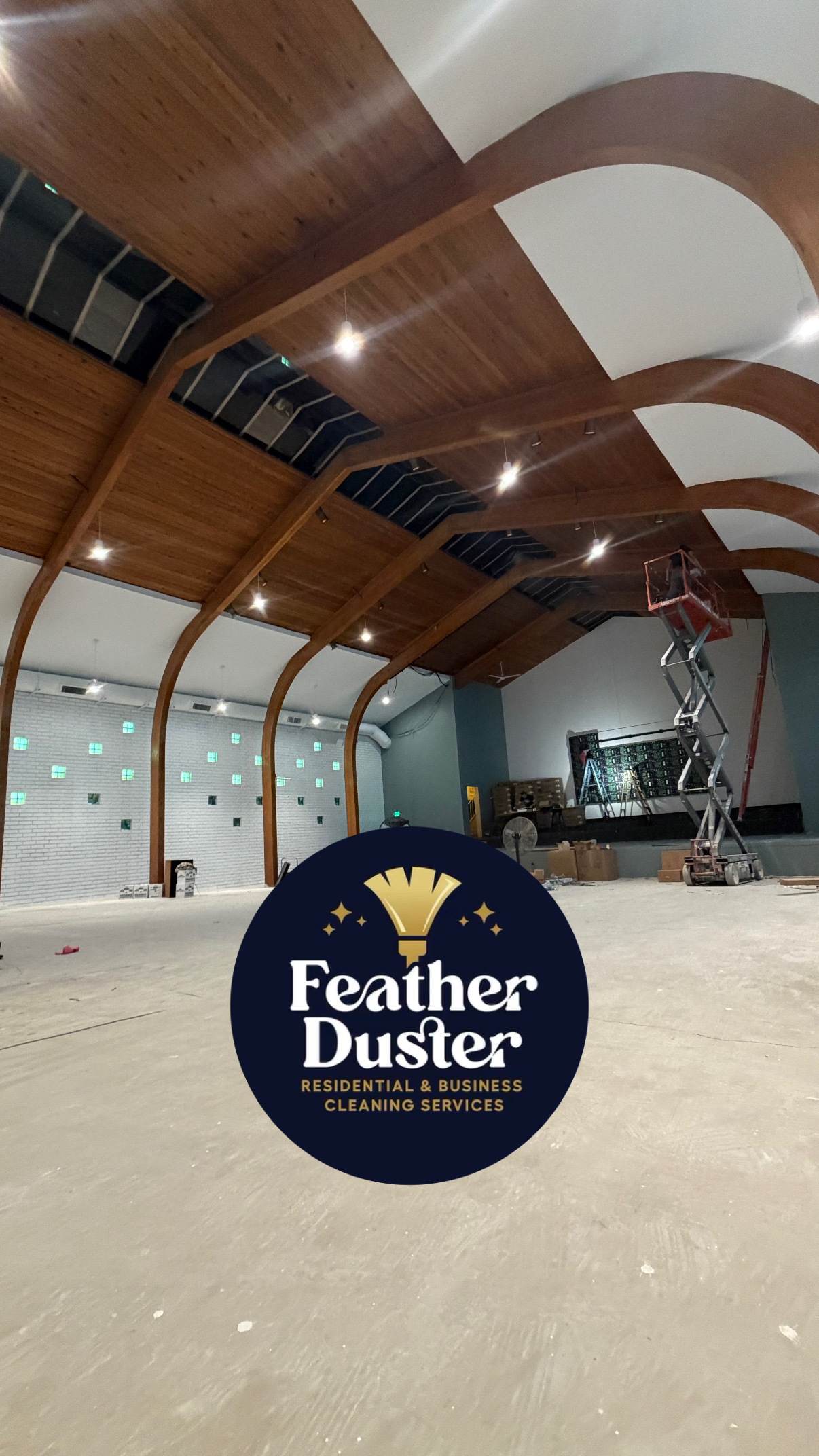 Wide-open event venue with vaulted wood ceilings prepared by Feather Duster Cleaning