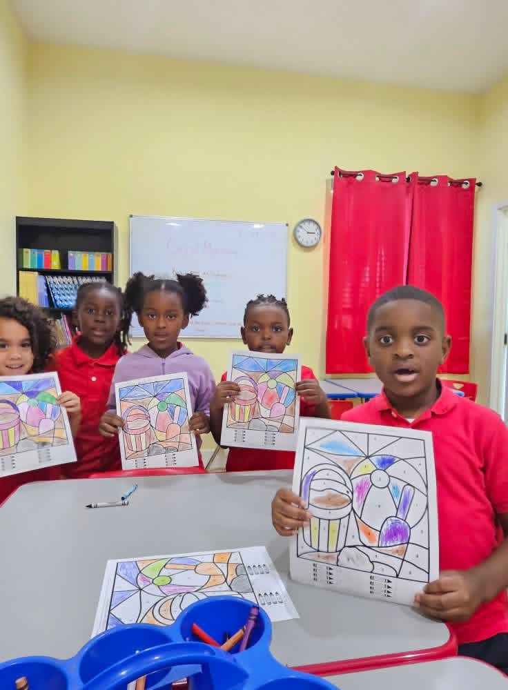 MBEE students proudly showing their artwork