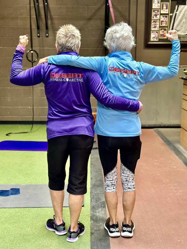 senior women flexing biceps
