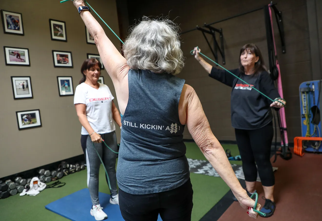 seniors warming up with exercise tubing
