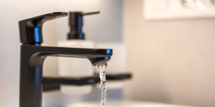 A close up image of a tap that does not utilise an aerator