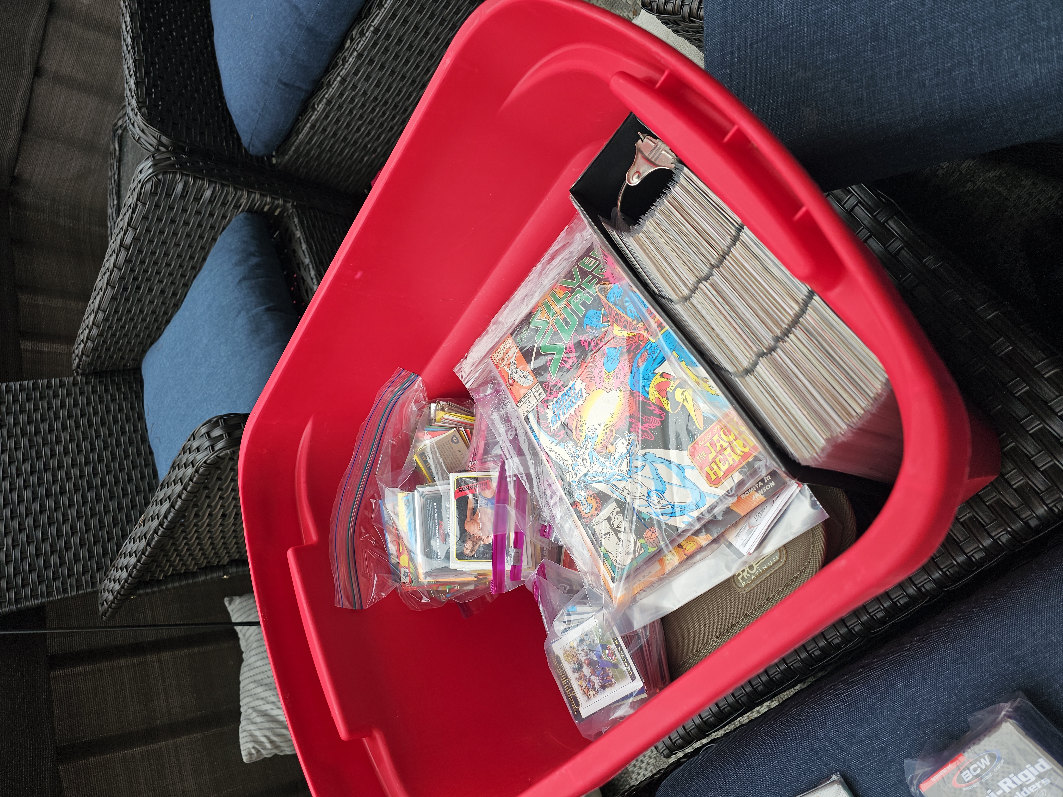 A holographic Pokemon card held in hand