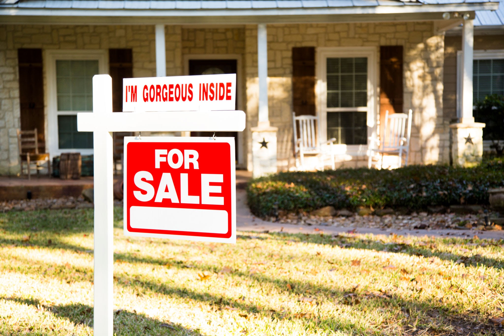 for sale sign in front yard