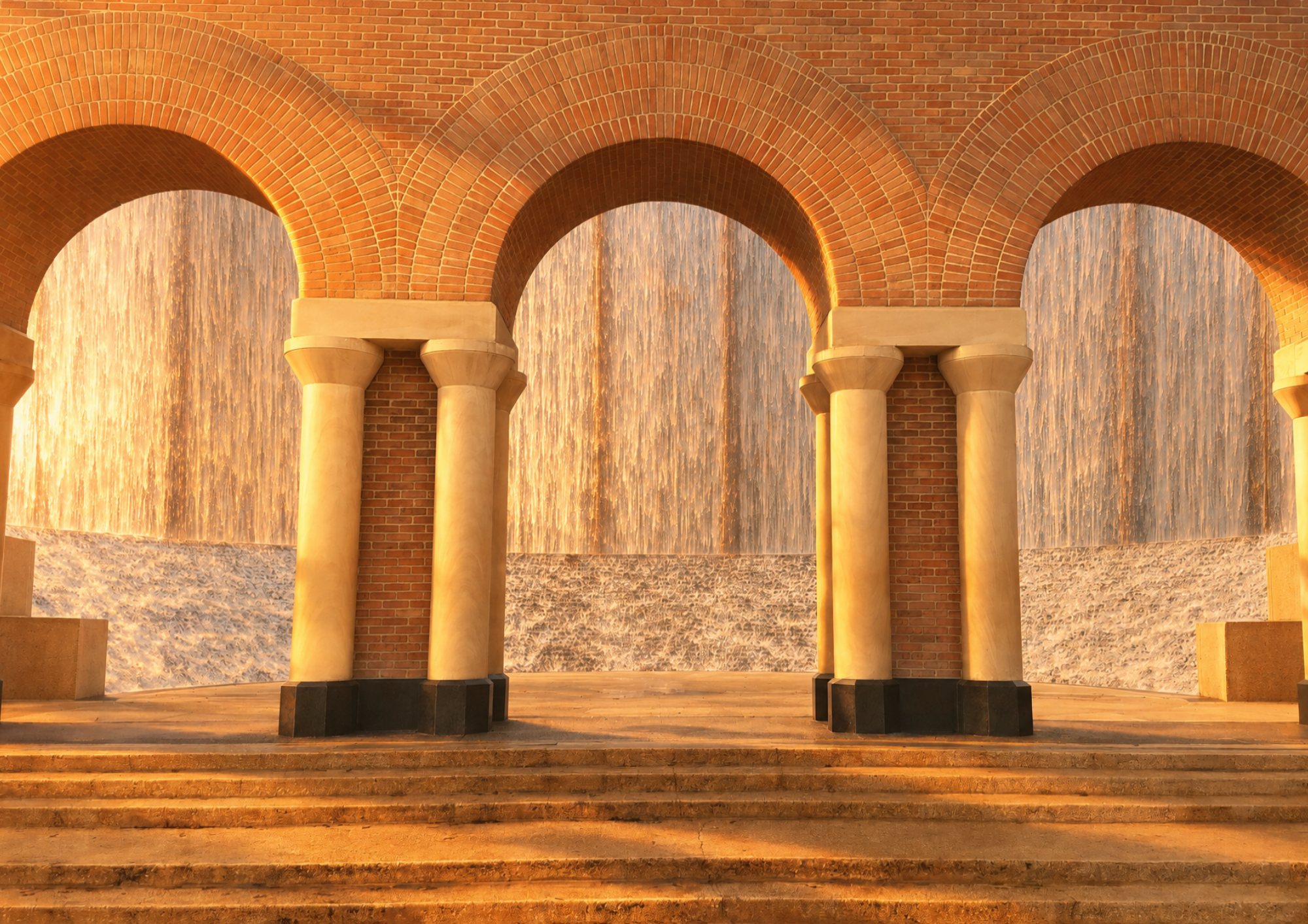 Gerald D. Hines Waterwall arches at golden hour