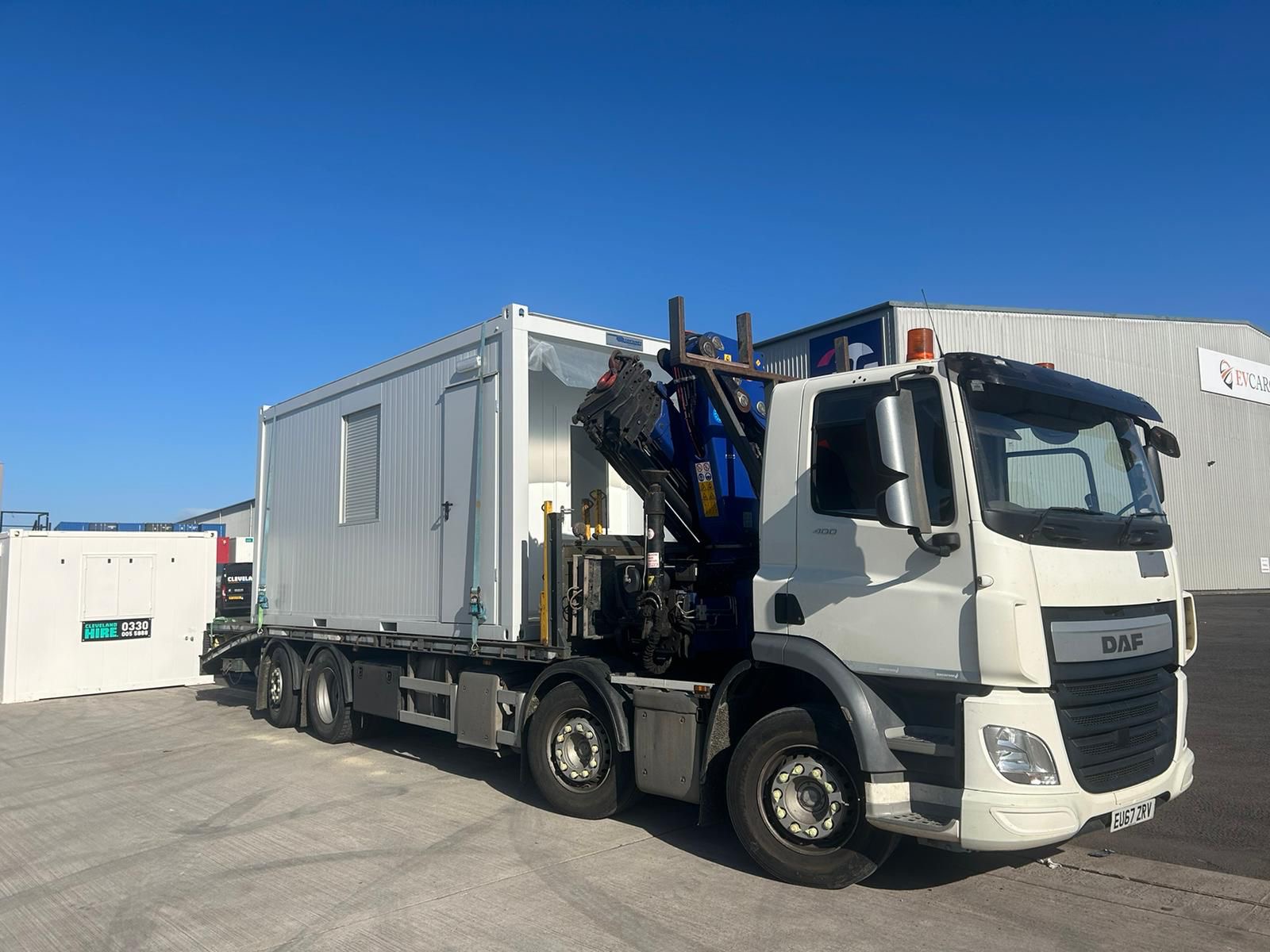 HIAB truck delivering storage container