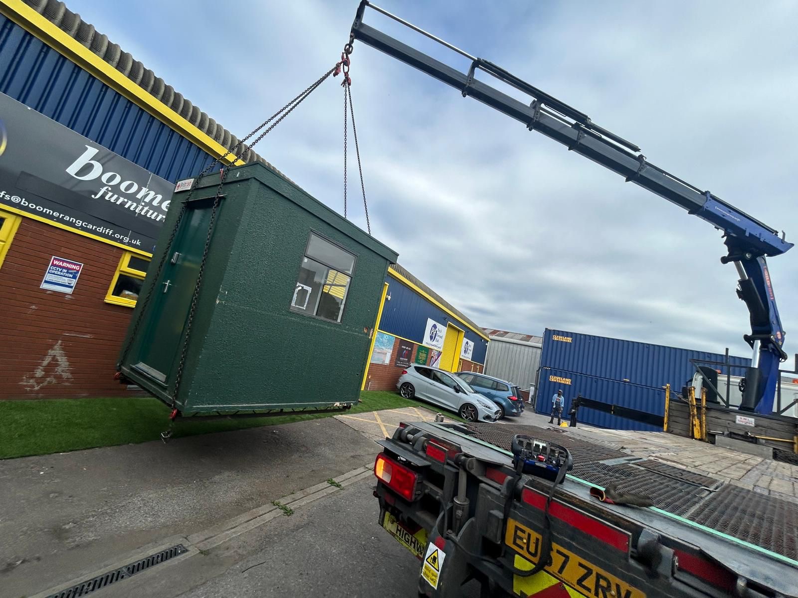 Welfare cabin being lifted by HIAB crane