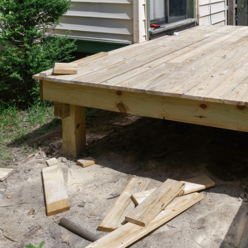 Close up of fresh wooden deck boards being installed