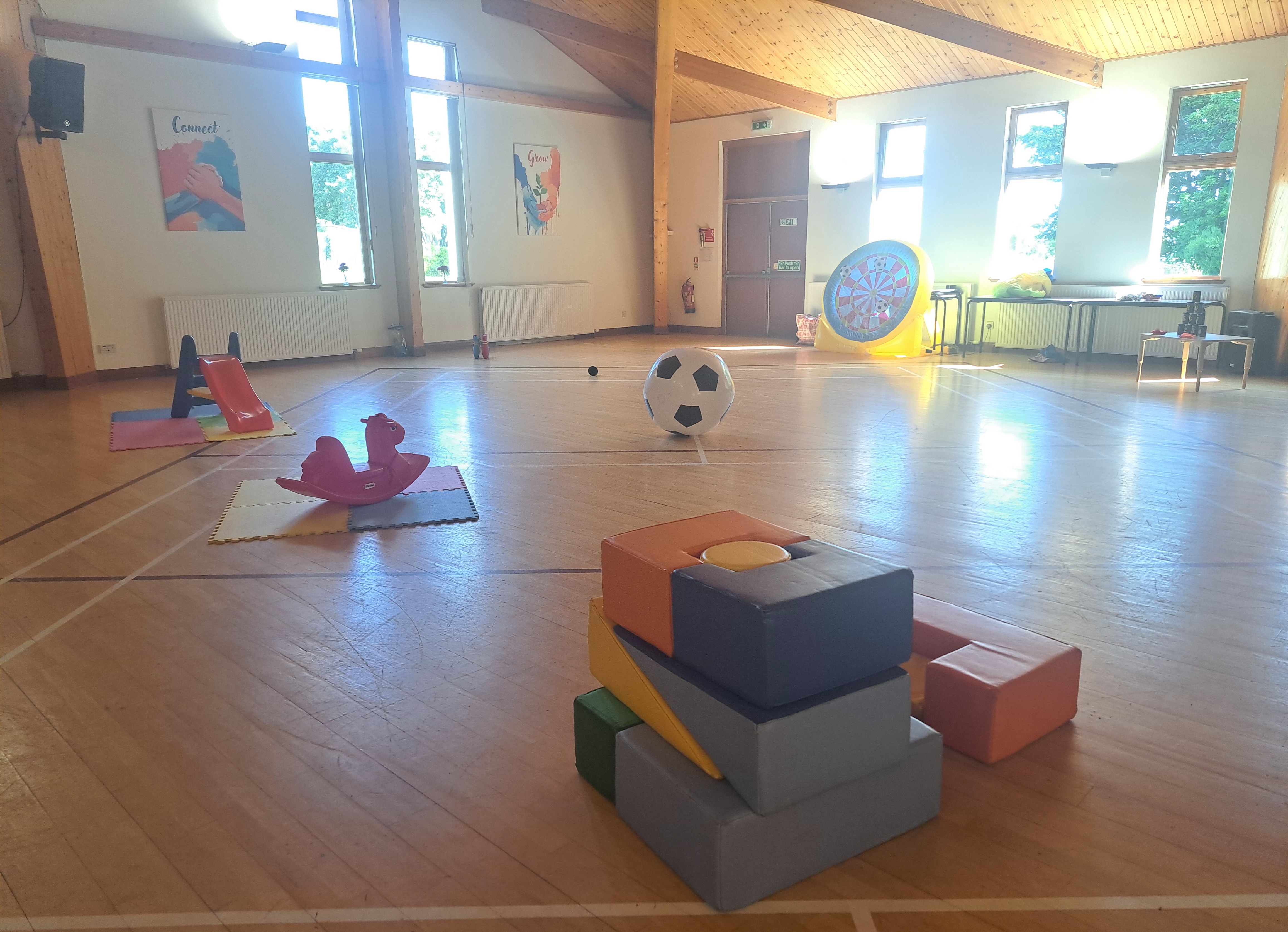 Hall set up with toys and activities for Mainly Play