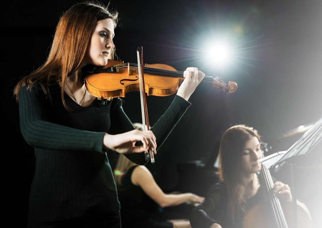 female violin player orchestra