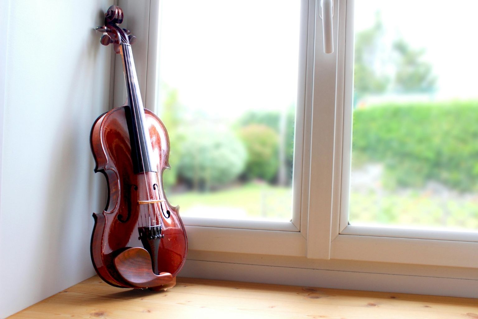 How to Rest Without Feeling Guilty as a Musician A violin rested near the windows after practice