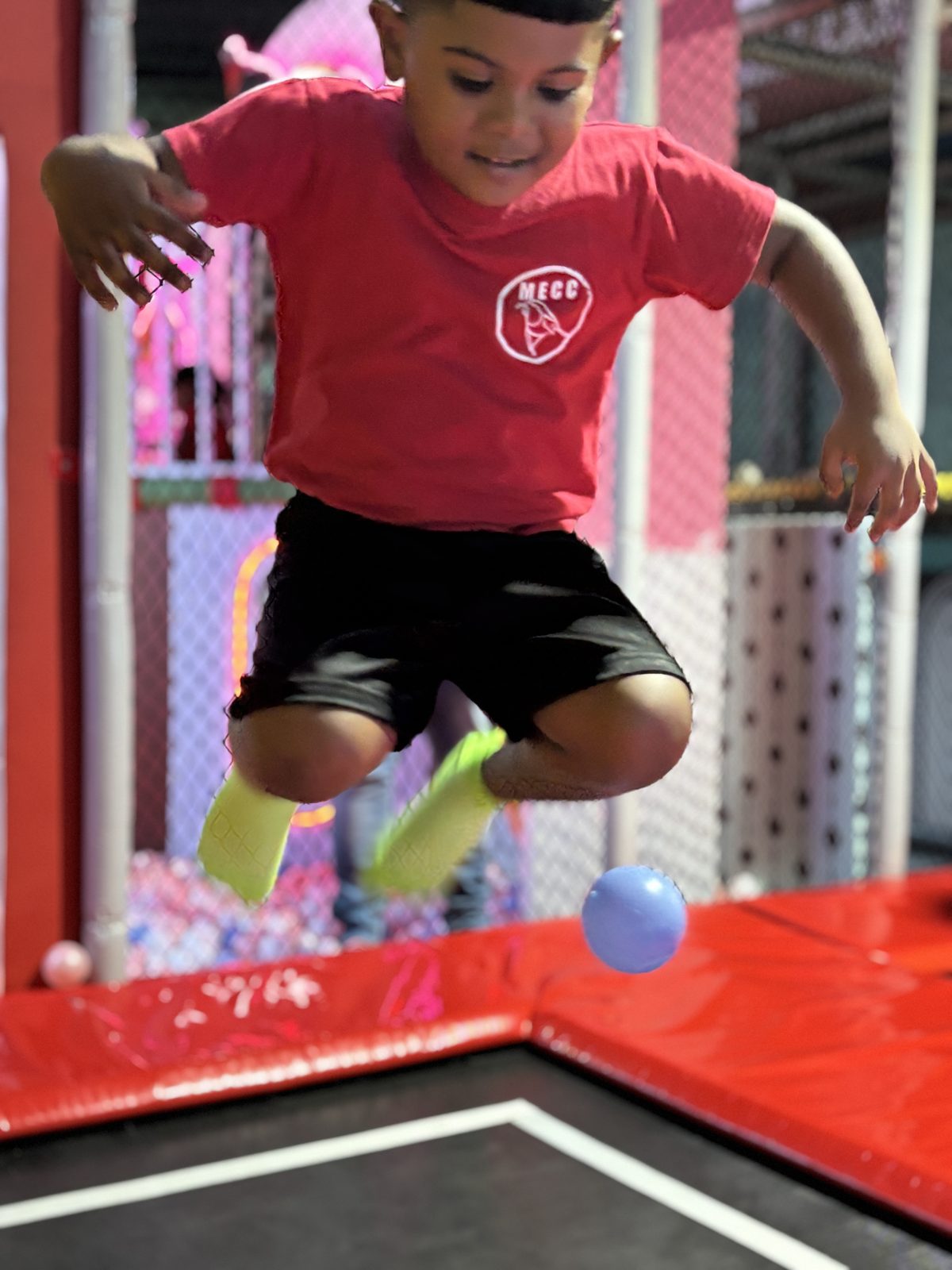 Boy playing in the ball pit