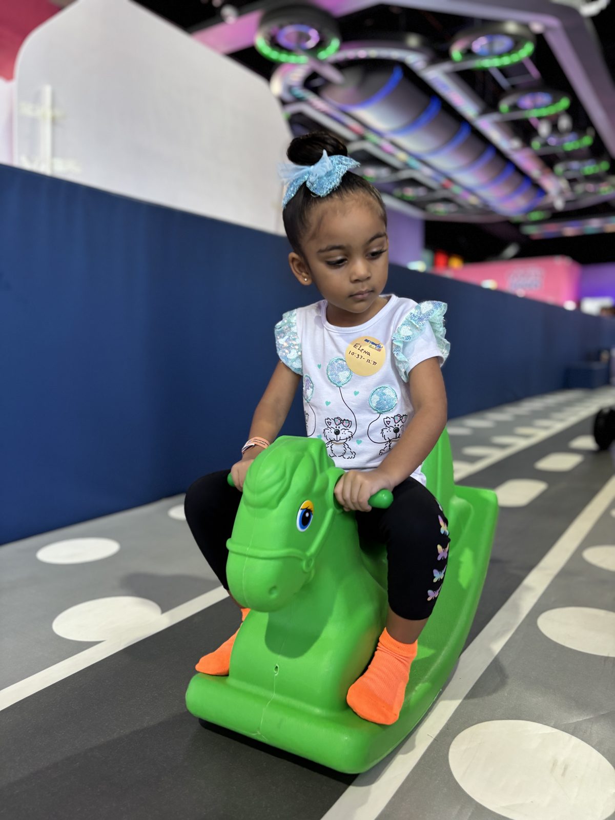 Toddler on a ride-on dinosaur toy