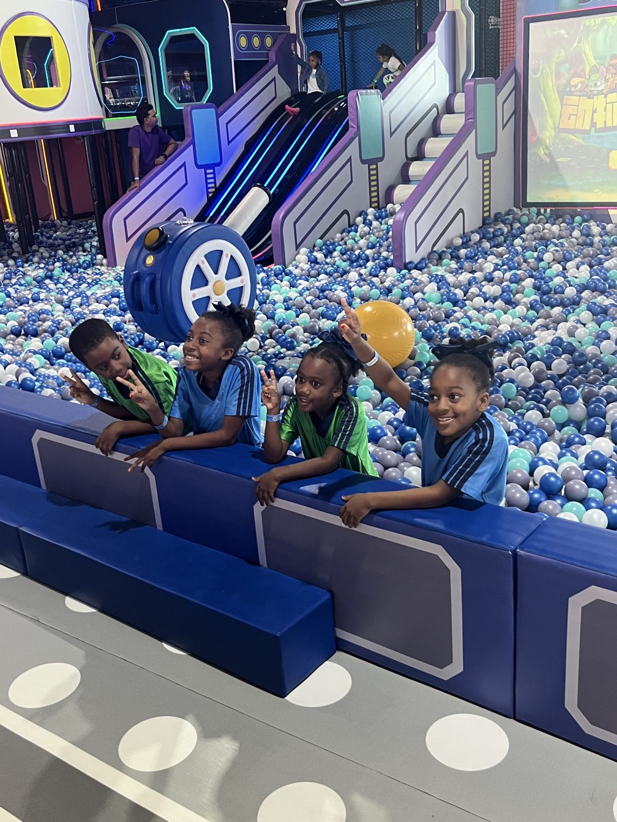 Kids playing together in the ball pit