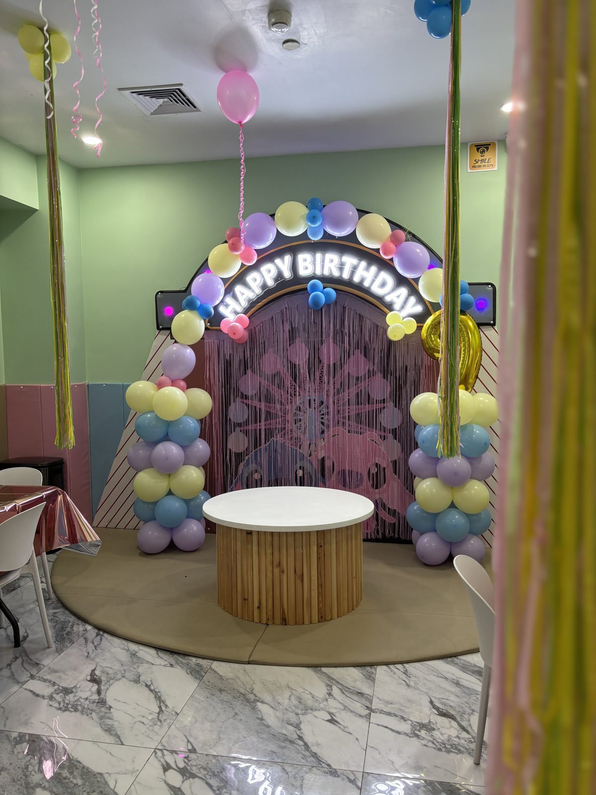 Happy Birthday balloon arch party setup