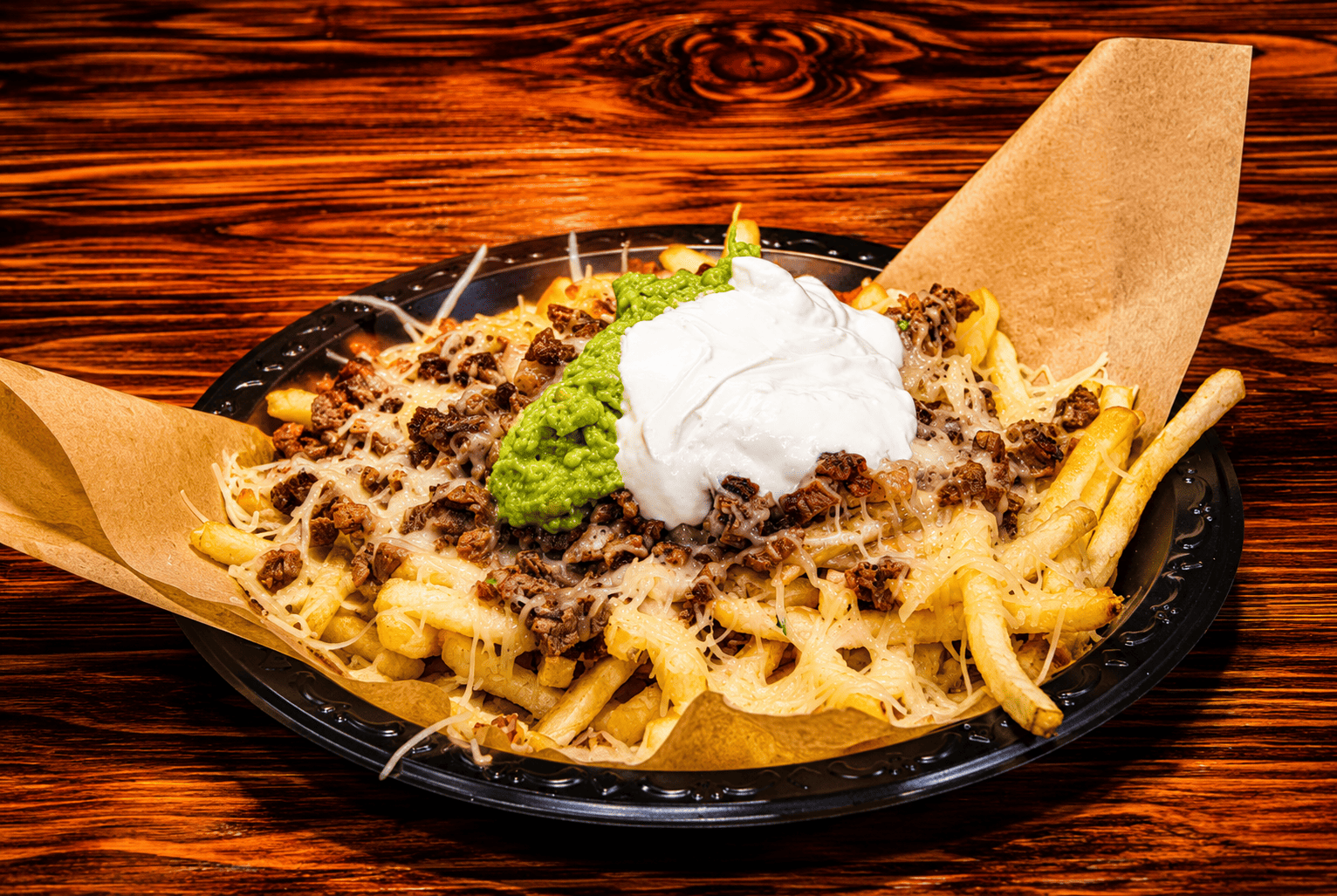 Loaded California burrito with carne asada fries cheese and guacamole at Alvarado's Pomona