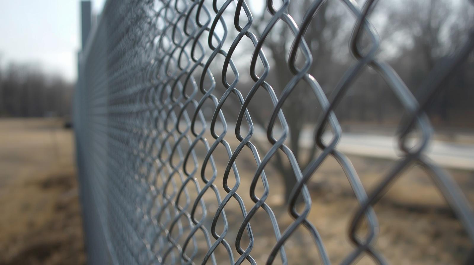 Chain link fence installation in Rockford IL surrounding residential yard.
