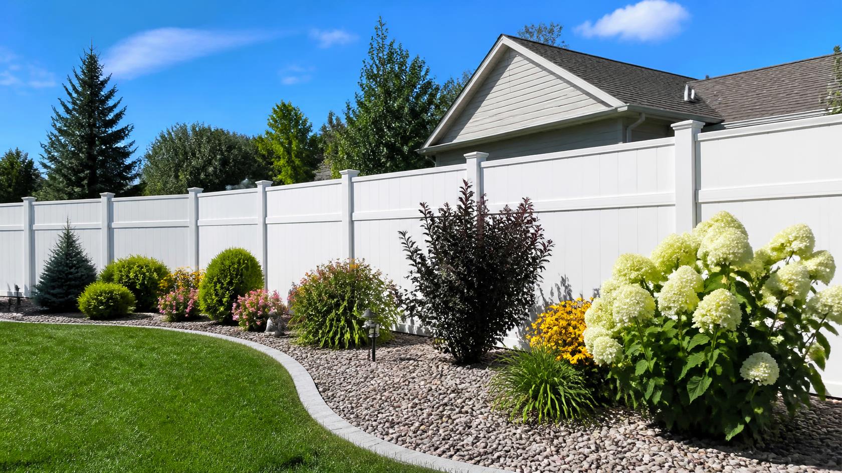 Vinyl fencing around a residential yard in Turtle, WI providing a clean appearance and low-maintenance boundary.