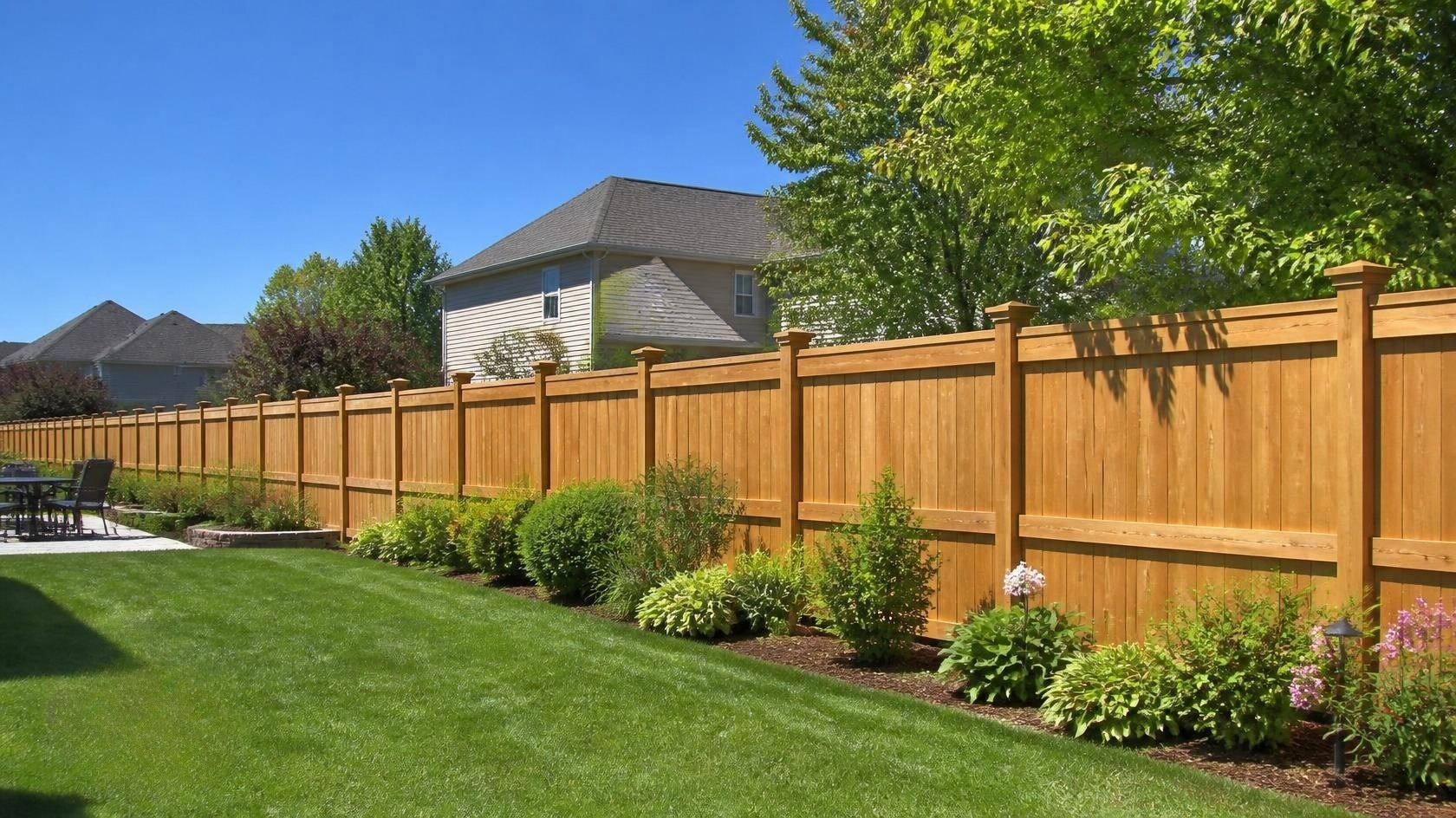 Residential fence replacement in Byron, IL with homeowners reviewing materials, labor, layout, removal, and other factors affecting project cost.