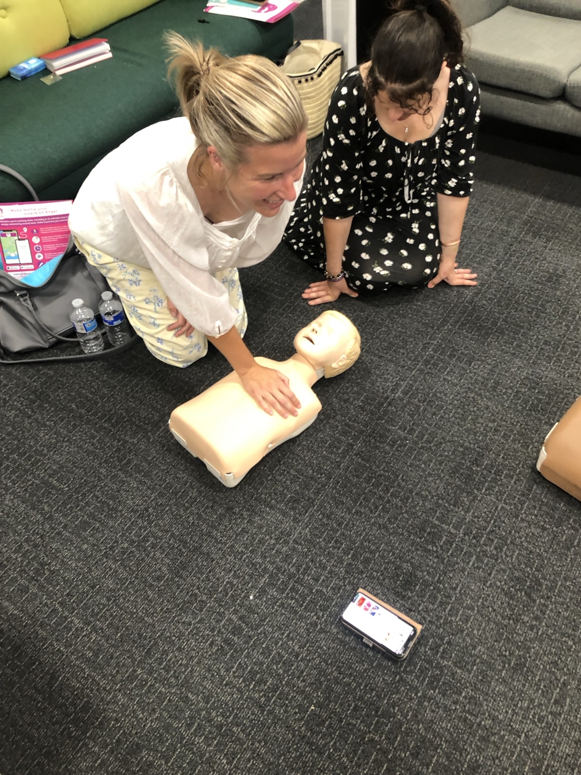 A learner practising child first aid on a paediatric training manikin